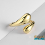 A bold and modern gold cuff bracelet, perfect for adding a statement to your look.