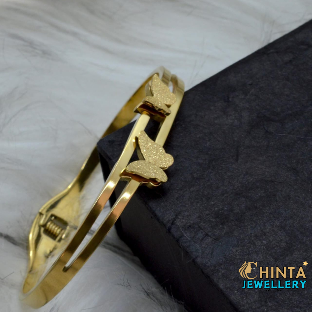 An elegant golden bracelet adorned with delicate butterfly charms, adding a graceful touch to any outfit.