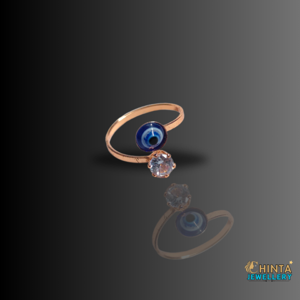 Ward off negativity with this elegant gold-plated ring featuring a captivating evil eye charm and sparkling cubic zirconia accents. A perfect blend of style and protection.