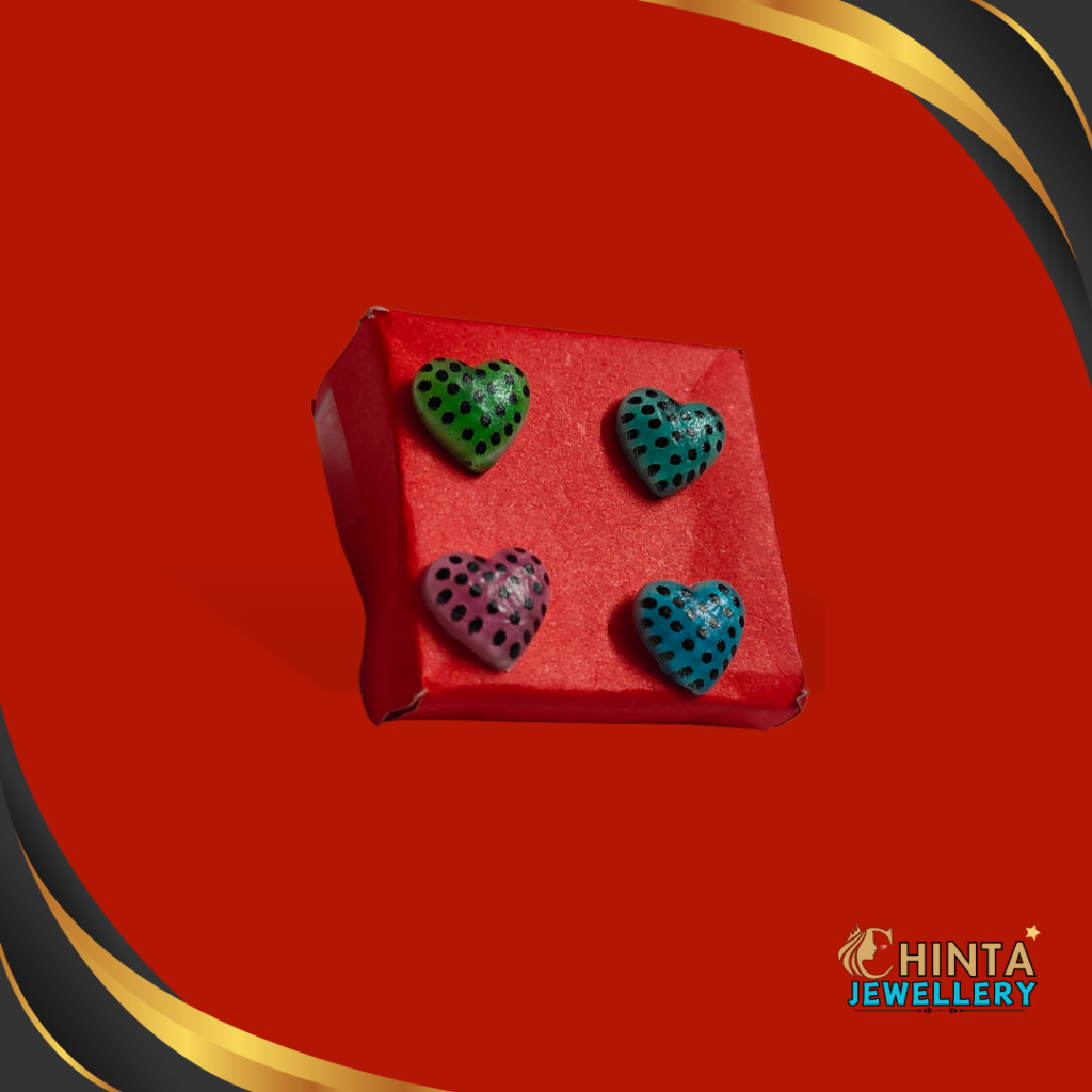 A colorful set of 4 heart-shaped stud earrings with bold polka dot patterns in green, blue, pink, and teal. Perfect for adding a playful vibe to your outfits!