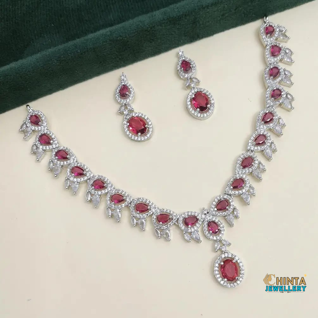 A stunning ruby and diamond necklace set featuring an intricate design, perfect for weddings, parties, and special occasions. Crafted with high-quality materials to add a touch of luxury to your ensemble.