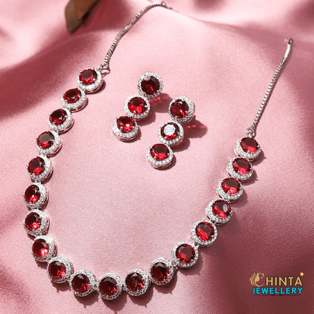 A breathtaking ruby and diamond necklace set, designed to add elegance and charm to any special occasion. This dazzling piece features brilliant red rubies surrounded by shimmering diamonds, set in a high-quality metal finish.
