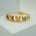 This stunning gold butterfly bracelet is a perfect blend of elegance and style