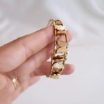 This stunning gold butterfly bracelet is a perfect blend of elegance and style