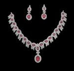 A stunning ruby and diamond necklace set featuring an intricate design, perfect for weddings, parties, and special occasions. Crafted with high-quality materials to add a touch of luxury to your ensemble.