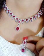 A stunning ruby and diamond necklace set featuring an intricate design, perfect for weddings, parties, and special occasions. Crafted with high-quality materials to add a touch of luxury to your ensemble.